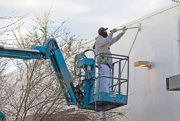 roller painting the outside