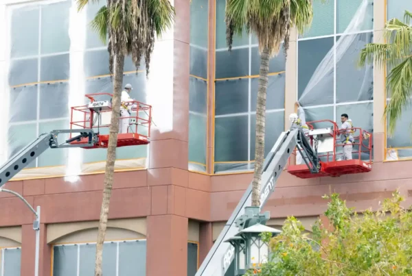 painters covering window glass