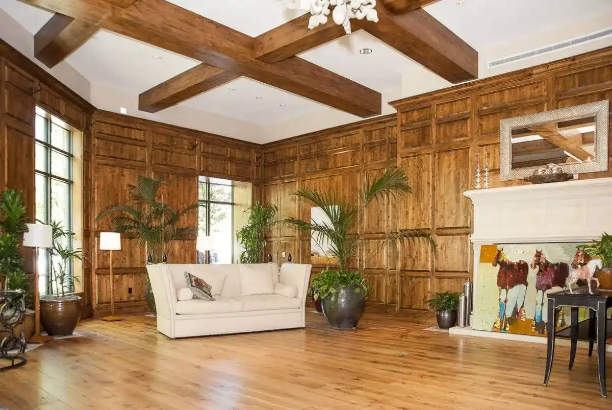 Room with wooden decorations on walls and floor.