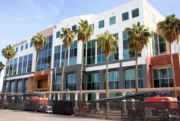 A commercial building with glass windows, showcasing its exterior color.