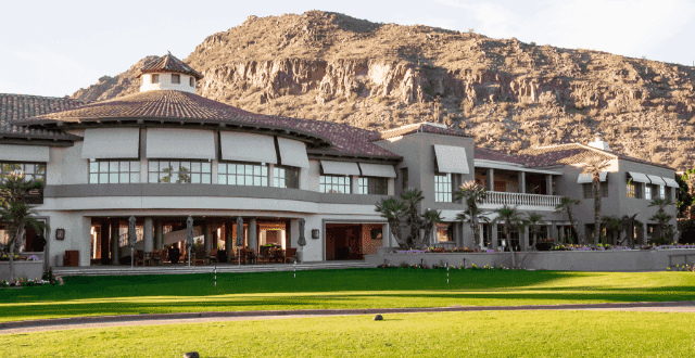 Building with rock mountain behind