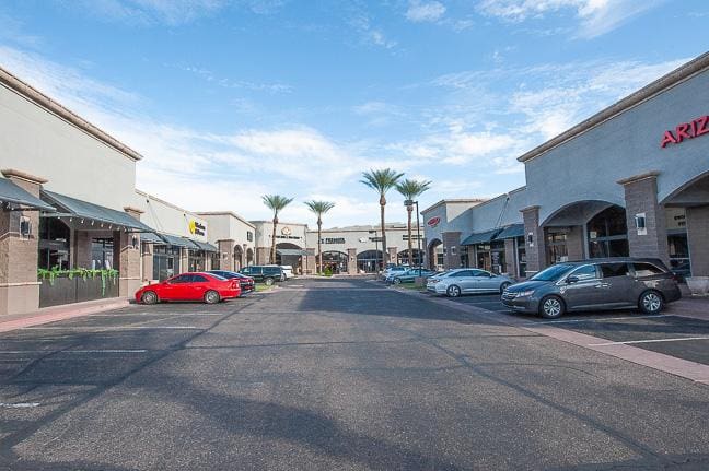 Zocallo Plaza Shops with cars parking