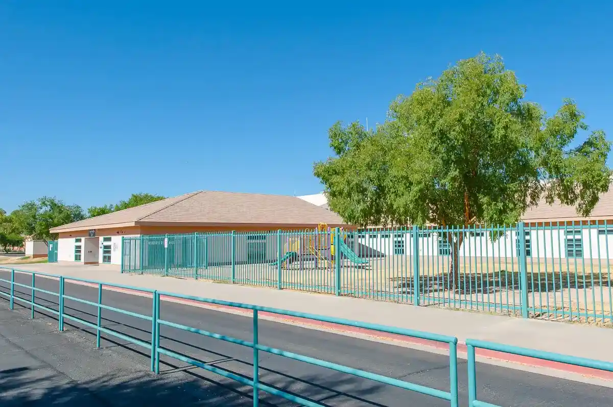 School with light blue fence